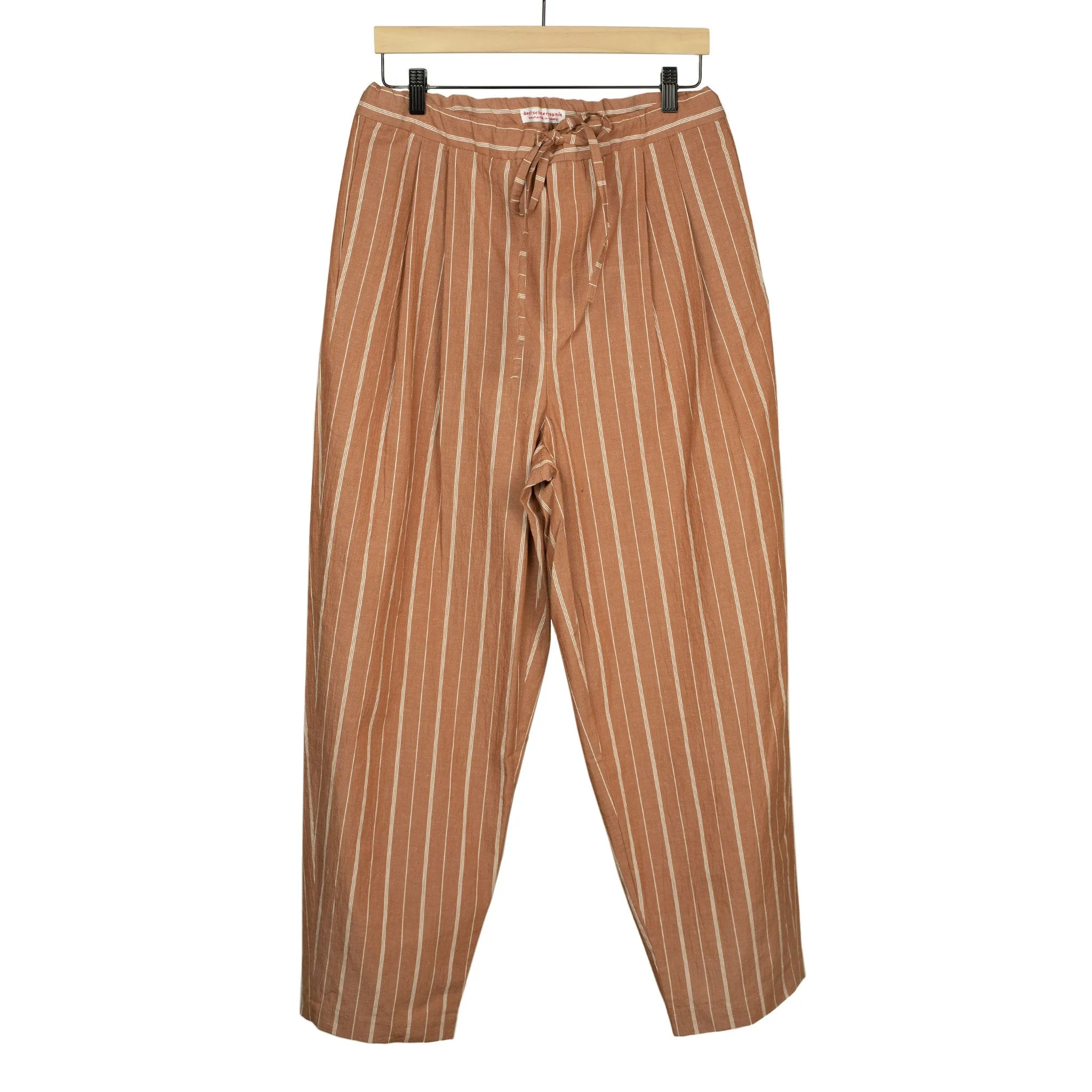 Pleated drawstring trousers in burnt orange and white striped cotton/linen