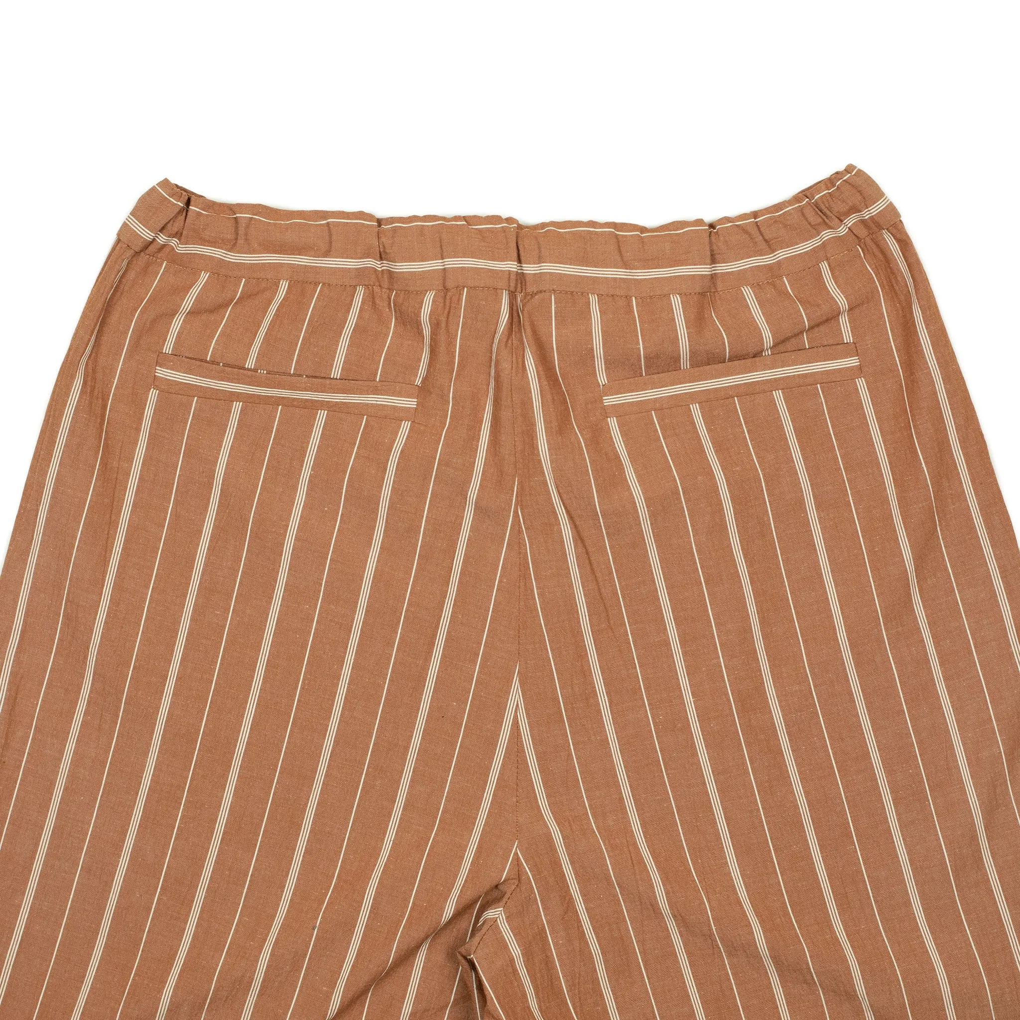 Pleated drawstring trousers in burnt orange and white striped cotton/linen