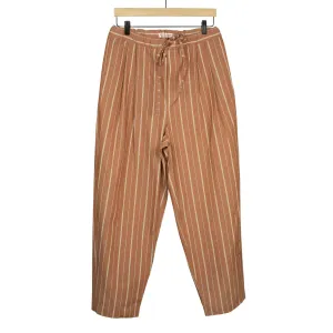 Pleated drawstring trousers in burnt orange and white striped cotton/linen