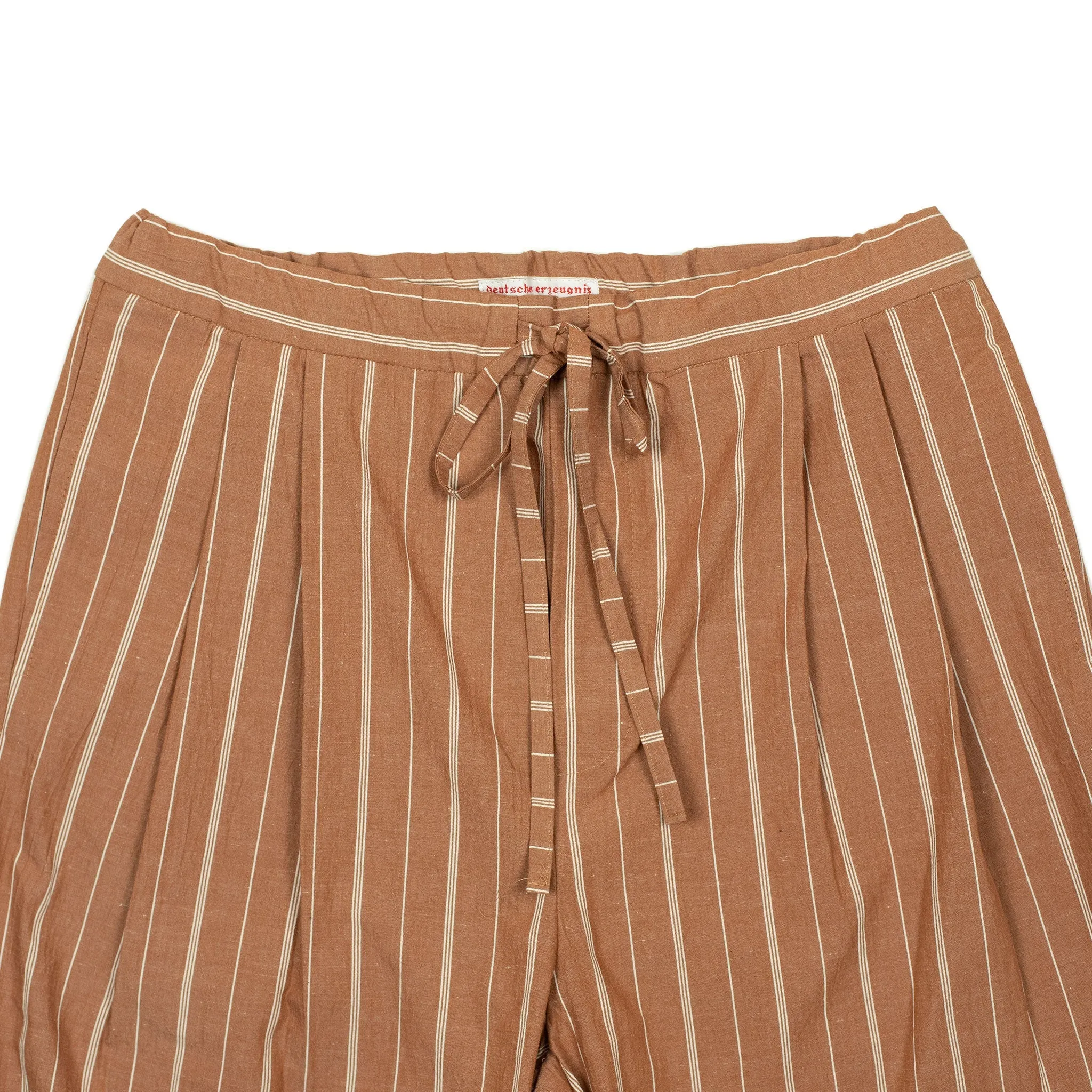 Pleated drawstring trousers in burnt orange and white striped cotton/linen